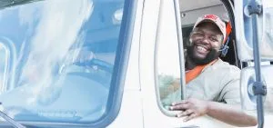 CDL driver in truck cab preparing for DOT physical vision test